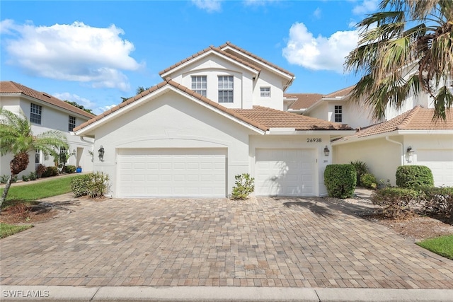 mediterranean / spanish house featuring a garage