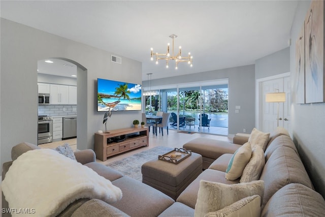 living room with a notable chandelier