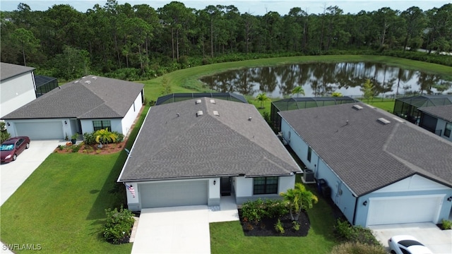 birds eye view of property with a water view