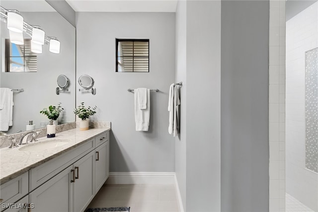 bathroom with vanity, tile patterned floors, and tiled shower