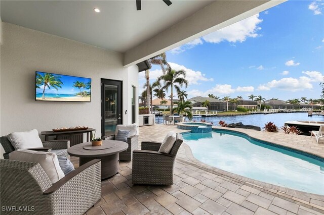 view of pool featuring ceiling fan, outdoor lounge area, a water view, a patio area, and an in ground hot tub