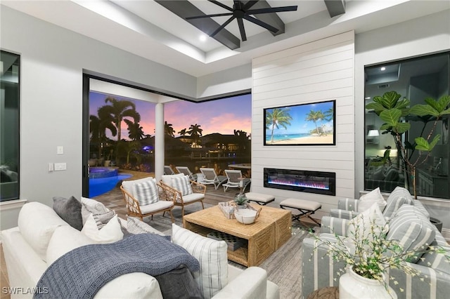 interior space featuring hardwood / wood-style flooring, ceiling fan, and a fireplace