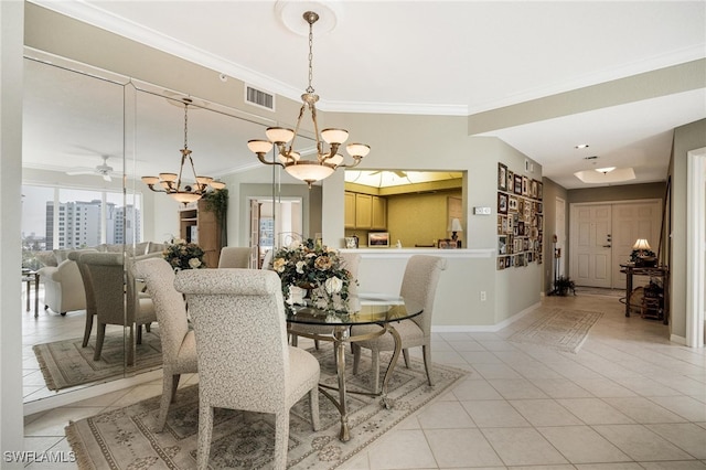 tiled dining space with crown molding and ceiling fan with notable chandelier