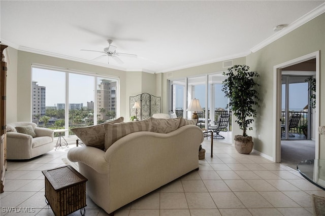 tiled living room featuring ornamental molding and ceiling fan