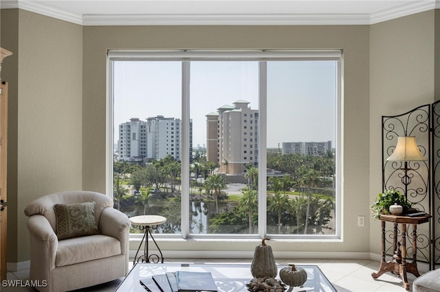 sitting room with crown molding and plenty of natural light