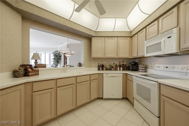 kitchen featuring ceiling fan with notable chandelier, light brown cabinetry, white appliances, and sink