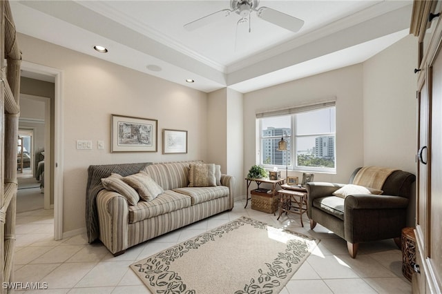 living room with ceiling fan, light tile patterned flooring, and ornamental molding