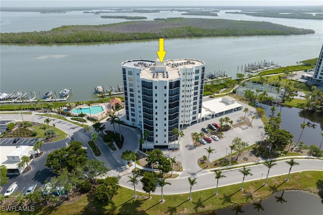 birds eye view of property with a water view