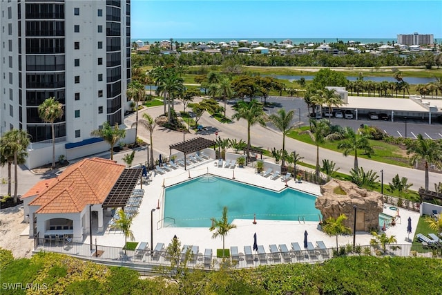 view of pool featuring a water view