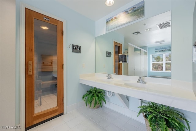 bathroom featuring tile patterned flooring and sink