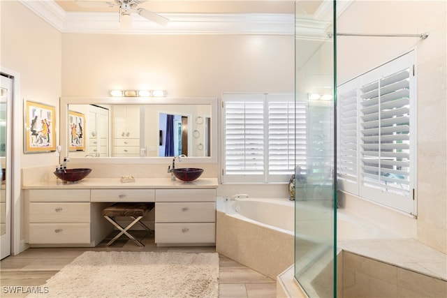 bathroom with ornamental molding, vanity, ceiling fan, and plus walk in shower