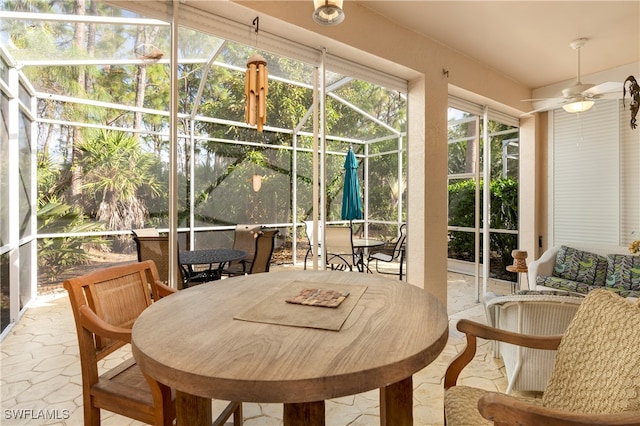 sunroom / solarium with ceiling fan