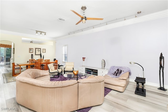 living room with ceiling fan, track lighting, ornamental molding, and light hardwood / wood-style flooring