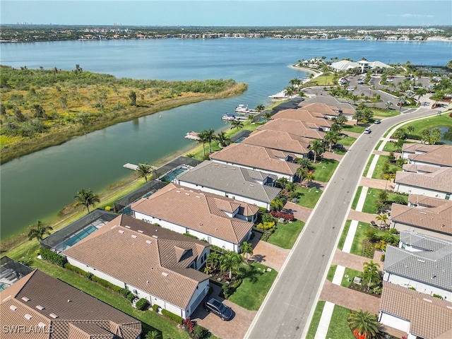 birds eye view of property featuring a water view