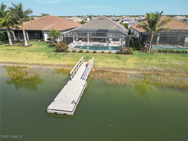 dock area with a yard, a water view, a fenced in pool, and a lanai