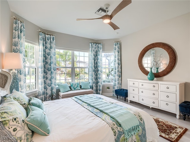 bedroom with hardwood / wood-style floors and ceiling fan