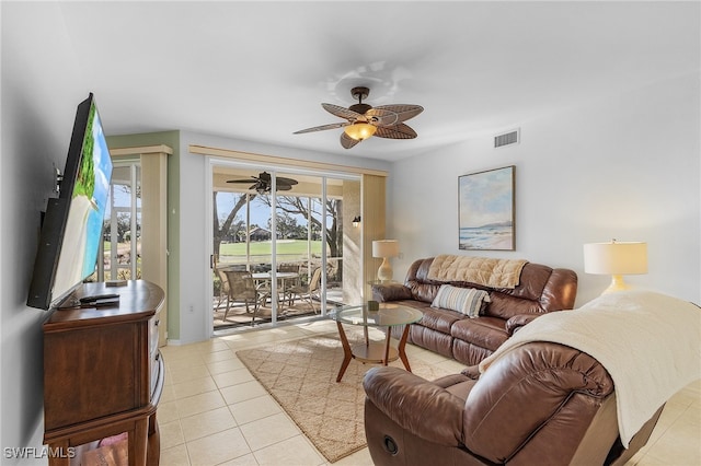 living room with light tile patterned floors and ceiling fan