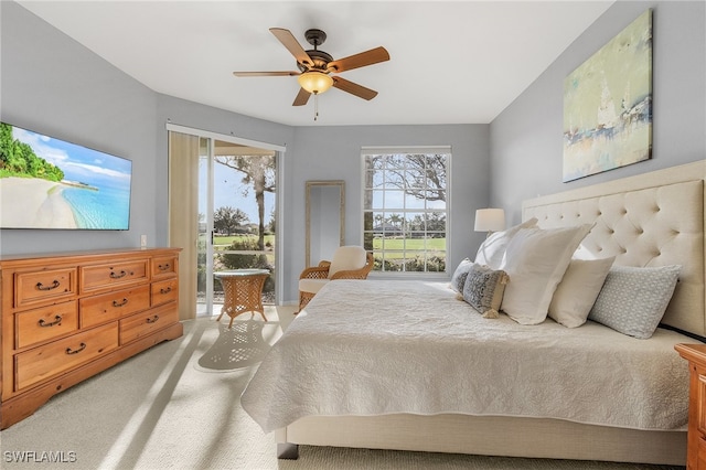 bedroom featuring ceiling fan, light colored carpet, and access to exterior