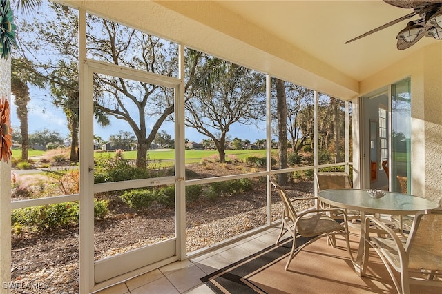 sunroom with ceiling fan and a wealth of natural light