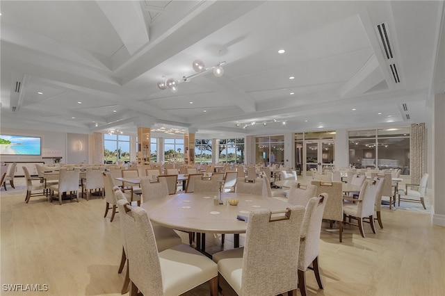 dining space featuring coffered ceiling, beamed ceiling, and light wood-type flooring