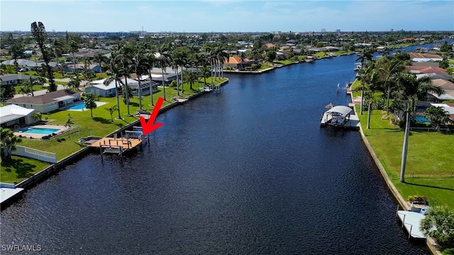 birds eye view of property featuring a water view