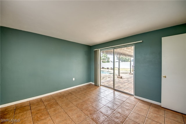 spare room with light tile patterned floors