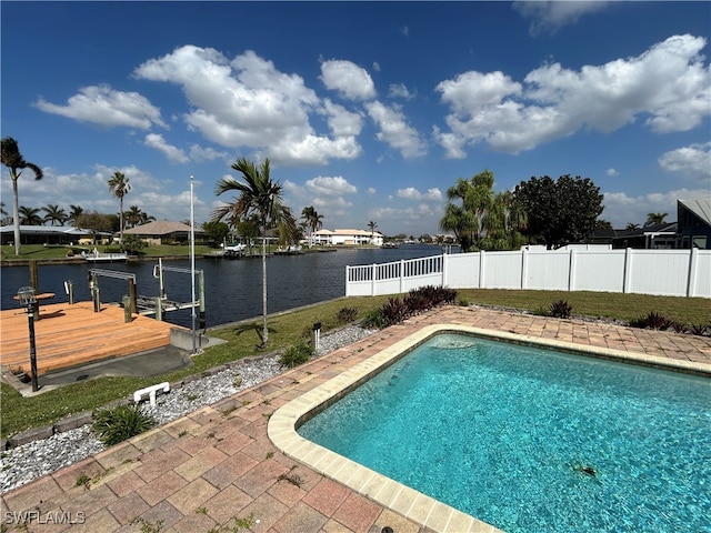 view of pool featuring a water view