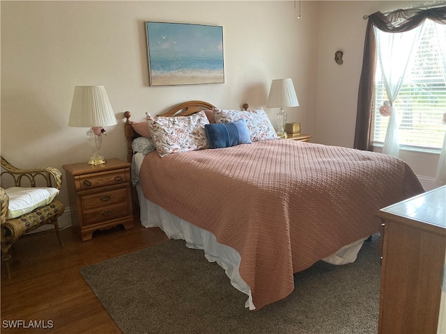 bedroom with wood finished floors