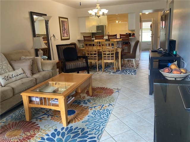 living room featuring light tile patterned floors and a notable chandelier