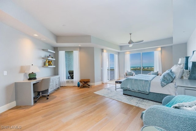 bedroom featuring ceiling fan, access to exterior, and light hardwood / wood-style flooring