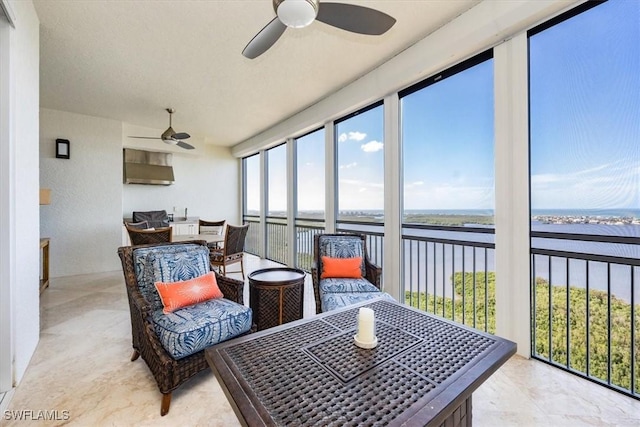 4851 Bonita Bay Blvd Unit 2203, Bonita Springs, FL 34134 - sunroom with ceiling fan, a water view, and outdoor dining area