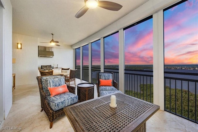 4851 Bonita Bay Blvd Unit 2203, Bonita Springs, FL 34134 - sunroom featuring ceiling fan, a water view, and outdoor dining space