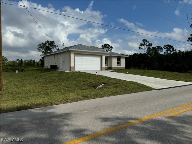 view of front of home featuring a front lawn and a garage