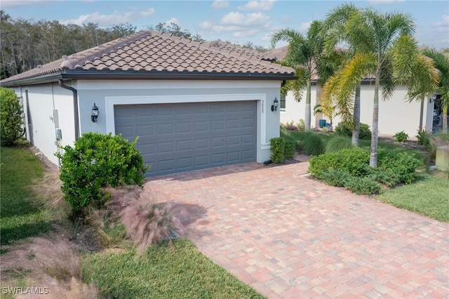 view of front of home with a garage