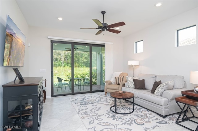 living room featuring light tile patterned floors and ceiling fan