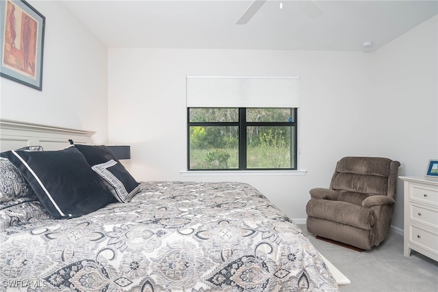 bedroom featuring light colored carpet and ceiling fan