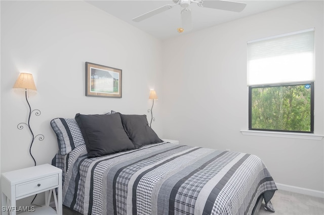 carpeted bedroom featuring ceiling fan