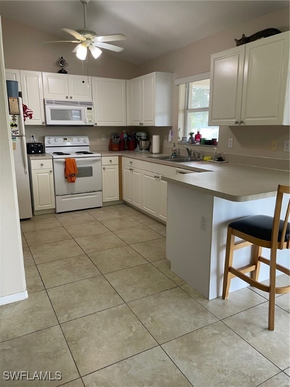 kitchen with kitchen peninsula, ceiling fan, white cabinetry, sink, and white appliances