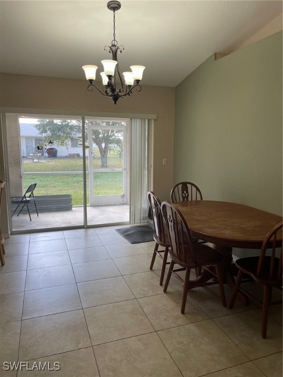 tiled dining space with a notable chandelier