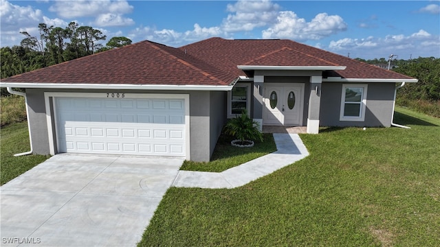 ranch-style house with a garage and a front yard