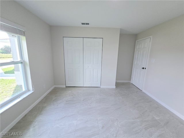 unfurnished bedroom featuring a closet