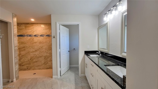 bathroom featuring vanity and a tile shower