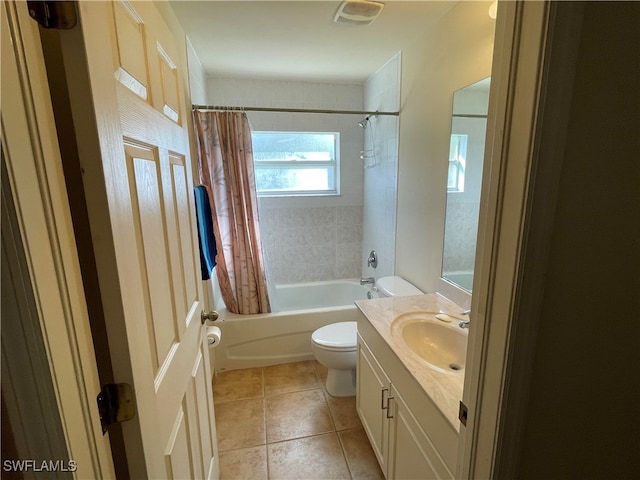 full bathroom featuring vanity, shower / tub combo with curtain, toilet, and tile patterned flooring