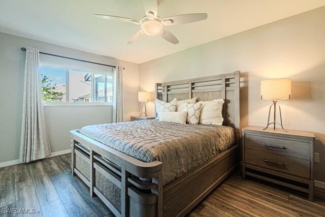 bedroom featuring dark hardwood / wood-style flooring and ceiling fan