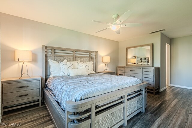 bedroom with ceiling fan and dark hardwood / wood-style flooring