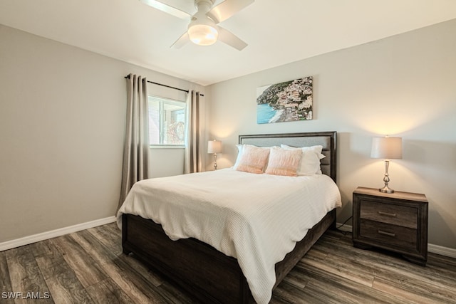 bedroom featuring dark hardwood / wood-style flooring and ceiling fan