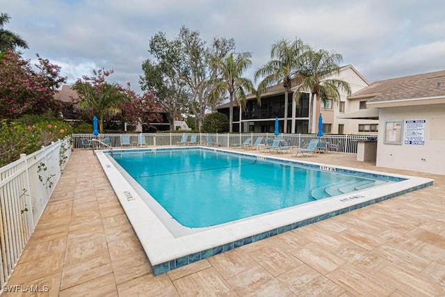 view of swimming pool featuring a patio area