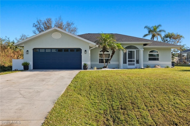 ranch-style house featuring a front lawn and a garage