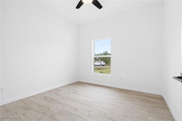 833 Newell St E, Lehigh Acres, FL 33974 - spare room featuring a ceiling fan and light wood-style floors