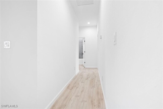 833 Newell St E, Lehigh Acres, FL 33974 - corridor with light wood-style flooring and recessed lighting